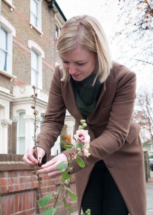 Nicole collecting seeds from street Hollyhocks